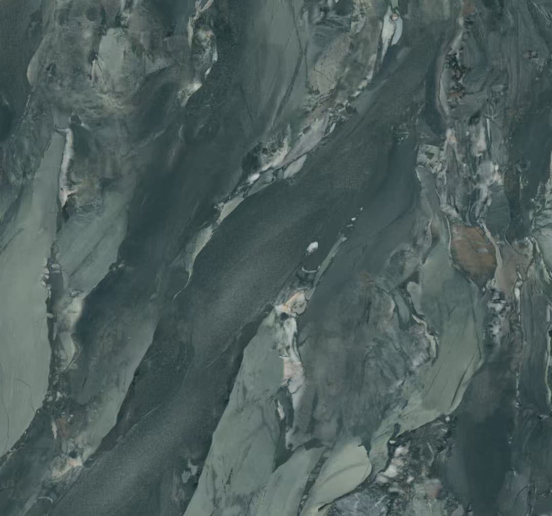 Deep green ceramic surface with pale branching veins.
